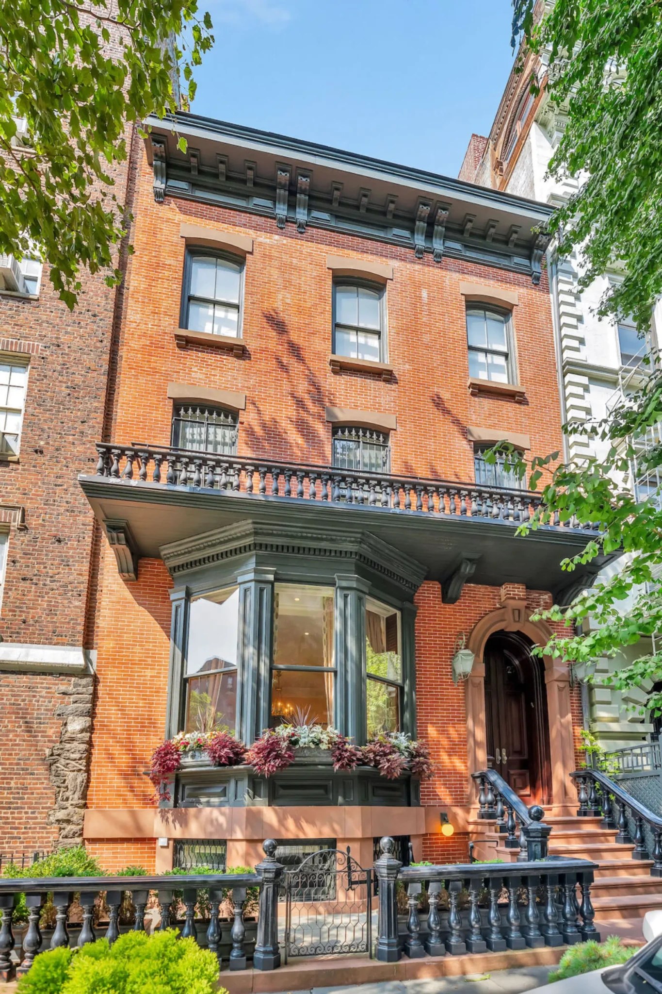 Brownstone townhouse facade, brick face, and entryway